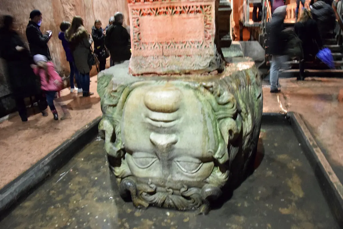 Medusa head at the base of a column in the cistern